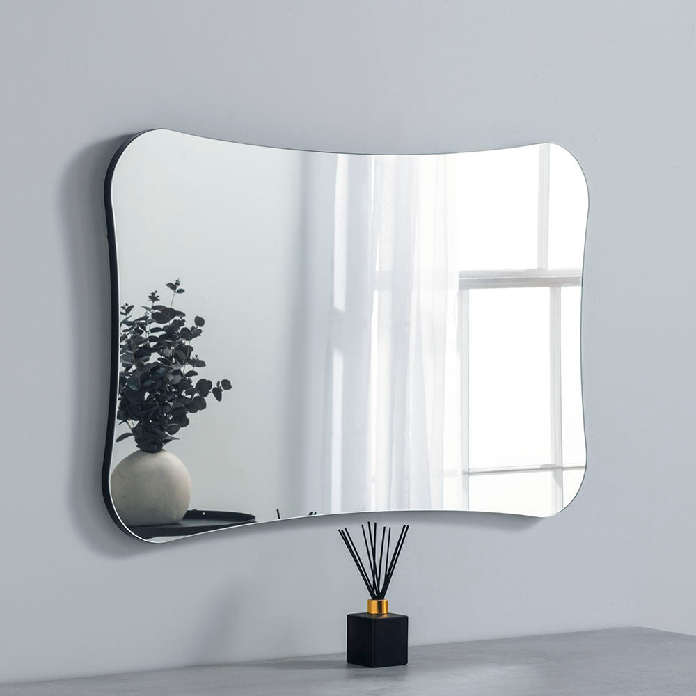 Curved frameless mirror