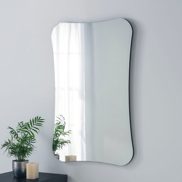 Curved frameless mirror