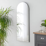 Frameless arched wall mirror