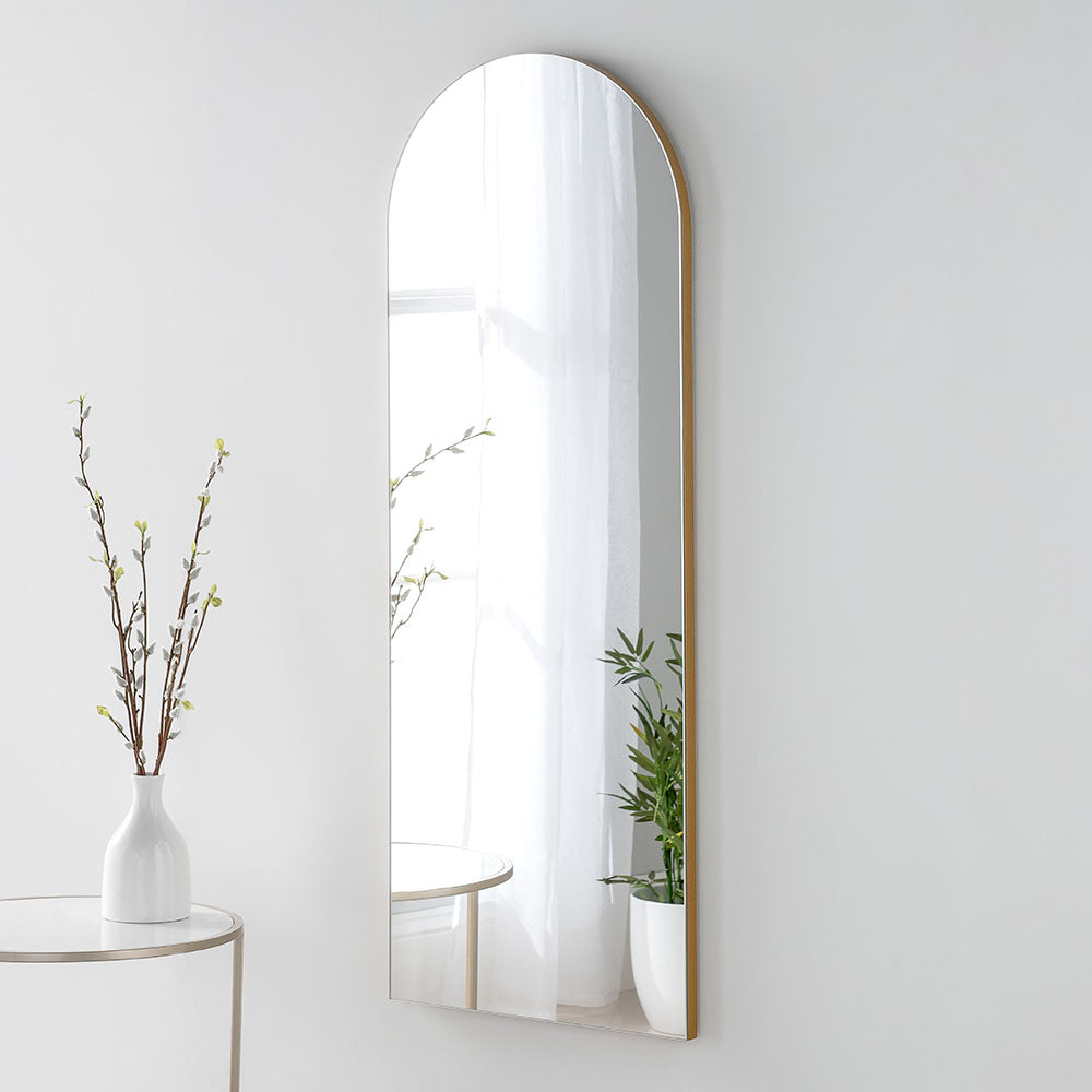 Frameless arched wall mirror